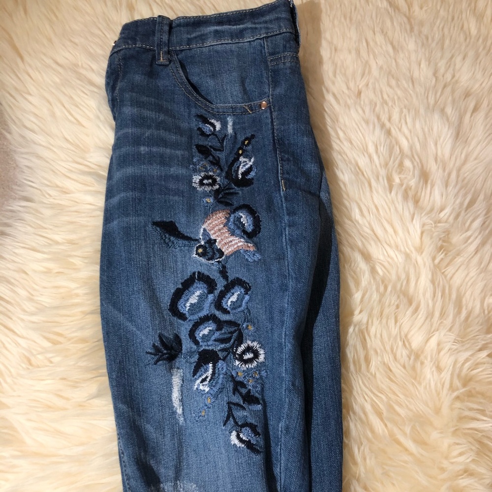 lightly distressed embroidered jeans